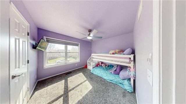 bedroom featuring baseboards, a ceiling fan, and carpet floors