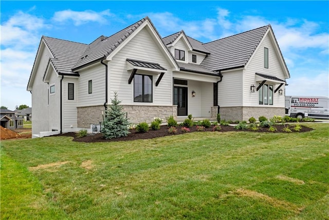 17216 Goddard St, Overland Park, KS 66221 - view of front of home featuring stone siding and a front lawn