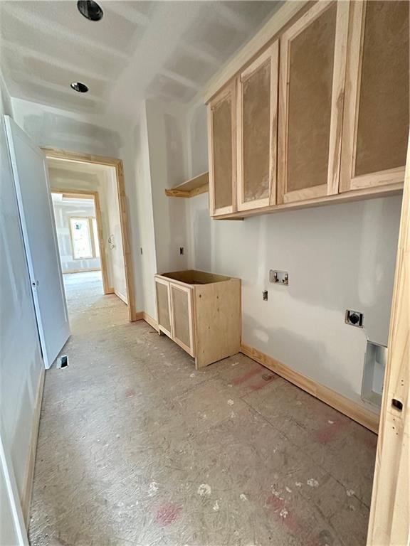 17216 Goddard St, Overland Park, KS 66221 - washroom with hookup for an electric dryer, baseboards, and cabinet space