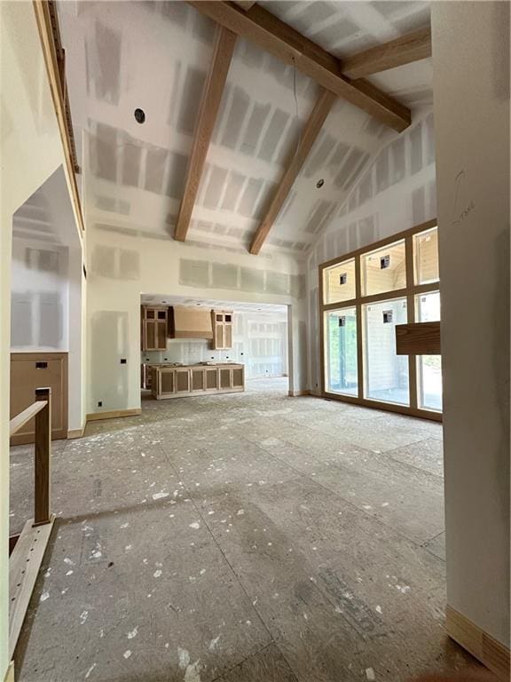 17216 Goddard St, Overland Park, KS 66221 - unfurnished living room featuring beam ceiling and high vaulted ceiling