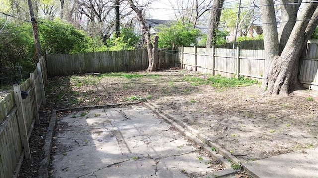 2907 E 61st St, Kansas City, MO 64130 - fenced backyard with a patio