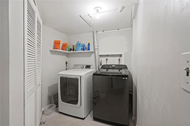 washroom with laundry area, attic access, and washer and dryer