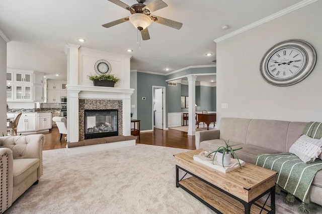 9011 NE 91st Ter, Kansas City, MO 64157 - living area featuring a ceiling fan, wood finished floors, ornamental molding, recessed lighting, and a multi sided fireplace