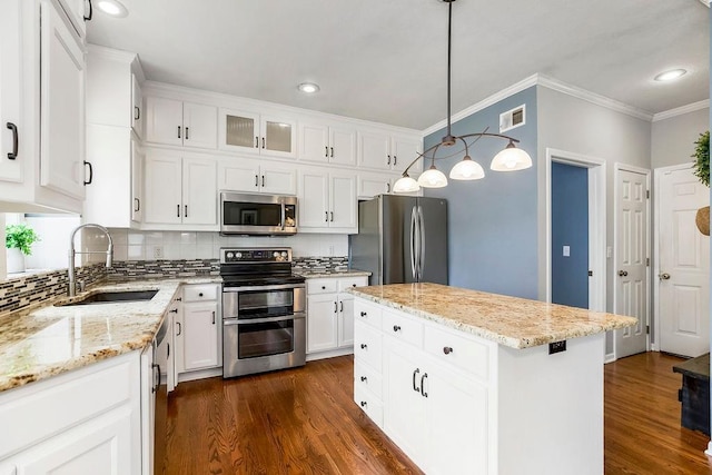 9011 NE 91st Ter, Kansas City, MO 64157 - kitchen with appliances with stainless steel finishes, a sink, dark wood-style floors, crown molding, and tasteful backsplash
