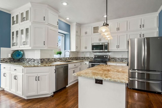 9011 NE 91st Ter, Kansas City, MO 64157 - kitchen with stainless steel appliances, a sink, white cabinetry, light stone counters, and a kitchen island