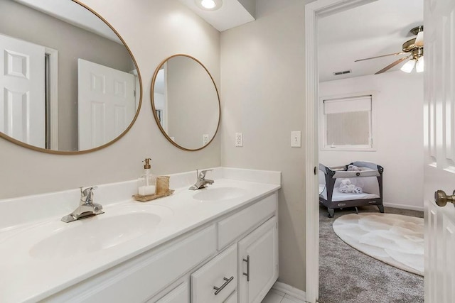 9011 NE 91st Ter, Kansas City, MO 64157 - ensuite bathroom with double vanity, a ceiling fan, and baseboards