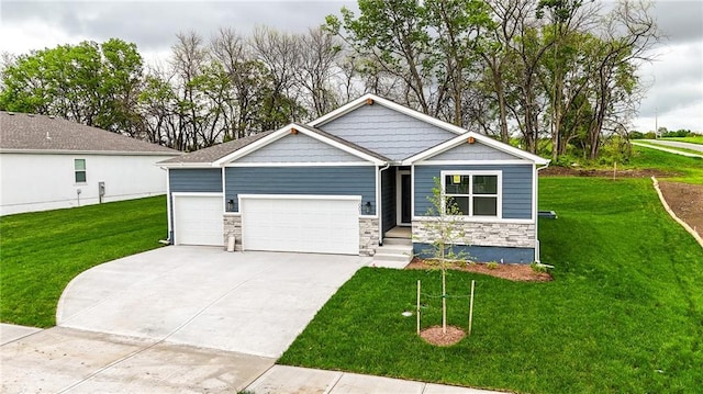 1001 Branchwood Ln, Raymore, MO 64083 - craftsman-style home featuring a garage, a front lawn, stone siding, and concrete driveway