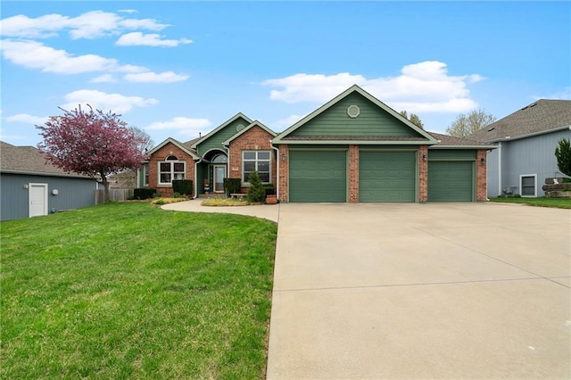 16011 Cedar St, Basehor, KS 66007 - view of front facade with concrete driveway, an attached garage, a front yard, and brick siding