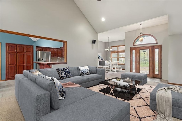 16011 Cedar St, Basehor, KS 66007 - living room featuring high vaulted ceiling, a chandelier, recessed lighting, and light tile patterned floors