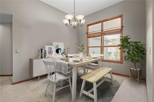 16011 Cedar St, Basehor, KS 66007 - dining area with a chandelier, light colored carpet, and a high ceiling