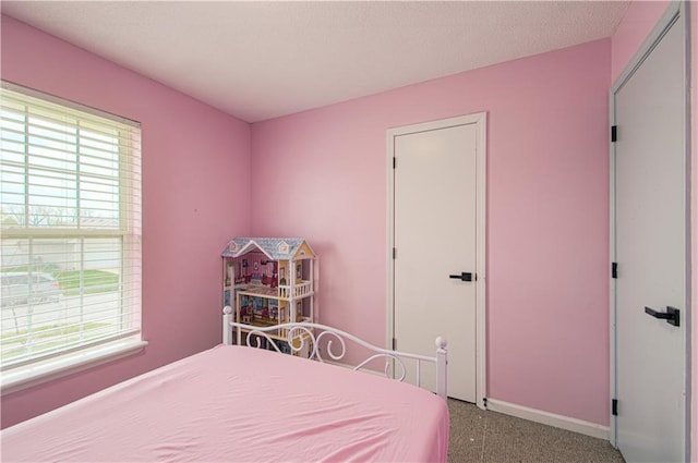 310 E 22nd St, Kearney, MO 64060 - bedroom featuring baseboards and carpet flooring