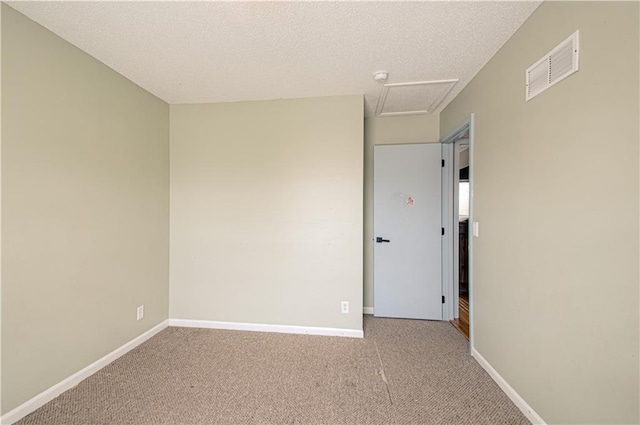 310 E 22nd St, Kearney, MO 64060 - spare room with attic access, baseboards, visible vents, and light colored carpet