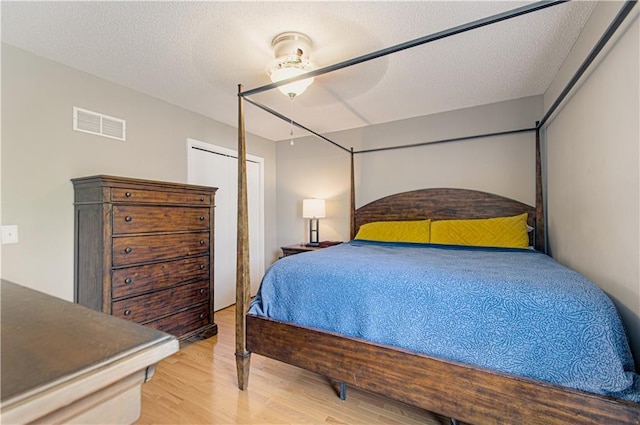 310 E 22nd St, Kearney, MO 64060 - bedroom featuring wood finished floors and visible vents