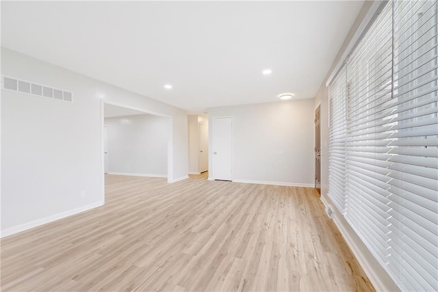 108 W Walnut St, Blue Springs, MO 64015 - empty room featuring light wood-style flooring, baseboards, visible vents, and recessed lighting