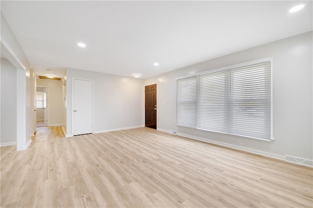 108 W Walnut St, Blue Springs, MO 64015 - unfurnished living room with visible vents, baseboards, recessed lighting, and light wood-style floors