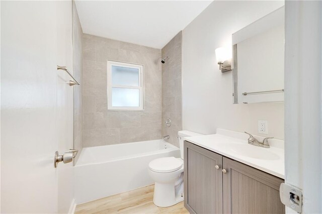 108 W Walnut St, Blue Springs, MO 64015 - bathroom featuring toilet, vanity, wood finished floors, and  shower combination