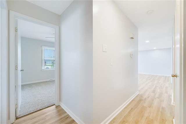 108 W Walnut St, Blue Springs, MO 64015 - hallway featuring light wood finished floors and baseboards