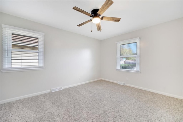 108 W Walnut St, Blue Springs, MO 64015 - carpeted spare room featuring visible vents, baseboards, and a ceiling fan