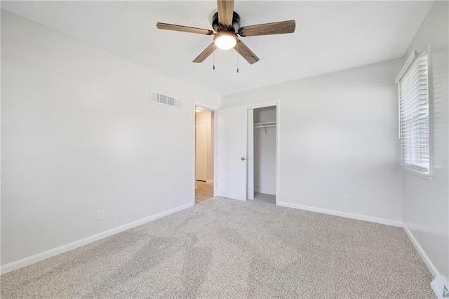108 W Walnut St, Blue Springs, MO 64015 - unfurnished bedroom with visible vents, baseboards, a closet, ceiling fan, and carpet flooring