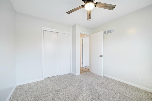 108 W Walnut St, Blue Springs, MO 64015 - unfurnished bedroom featuring baseboards, a closet, a ceiling fan, visible vents, and carpet