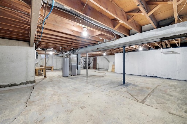 108 W Walnut St, Blue Springs, MO 64015 - unfinished basement featuring heating unit, stairway, and water heater