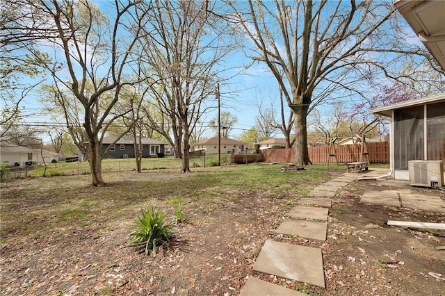 108 W Walnut St, Blue Springs, MO 64015 - view of yard with fence, a residential view, and a sunroom
