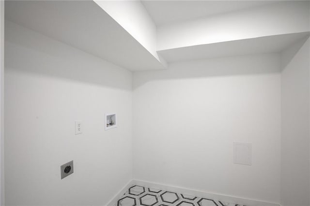 washroom with laundry area, electric dryer hookup, light floors, washer hookup, and baseboards