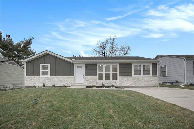 714 N Rogers St, Independence, MO 64050 - single story home with stone siding and board and batten siding