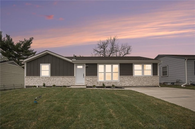 714 N Rogers St, Independence, MO 64050 - single story home featuring stone siding and board and batten siding