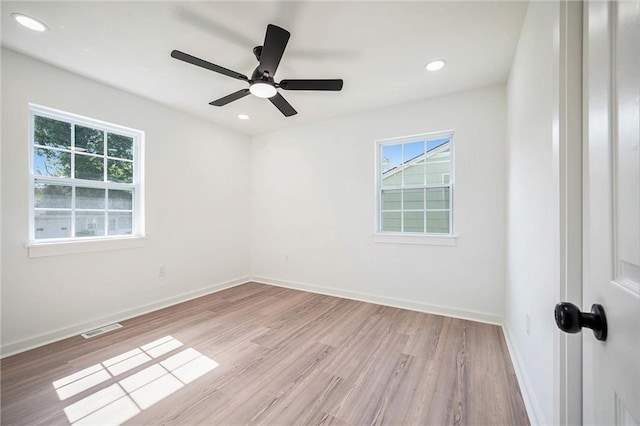 714 N Rogers St, Independence, MO 64050 - spare room featuring healthy amount of natural light, wood finished floors, ceiling fan, and recessed lighting