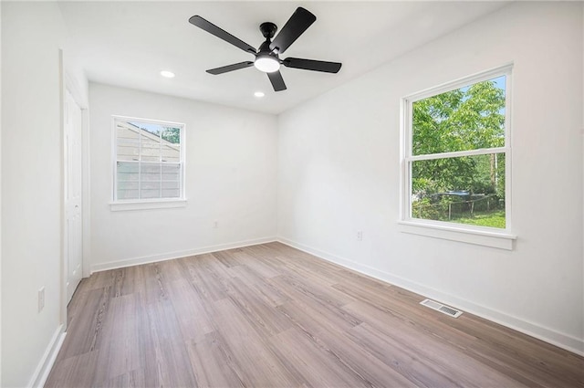 714 N Rogers St, Independence, MO 64050 - spare room featuring healthy amount of natural light, wood finished floors, a ceiling fan, and recessed lighting