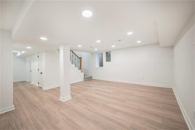 714 N Rogers St, Independence, MO 64050 - finished basement featuring stairway, light wood-style flooring, and recessed lighting