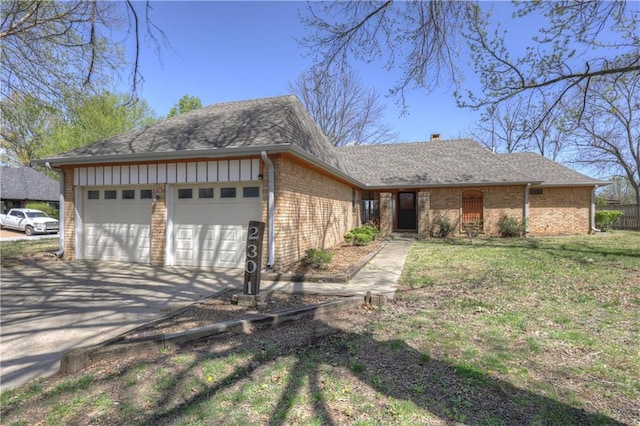 2301 S Stilwell St, Pittsburg, KS 66762 - ranch-style house featuring an attached garage, a chimney, concrete driveway, brick siding, and roof with shingles