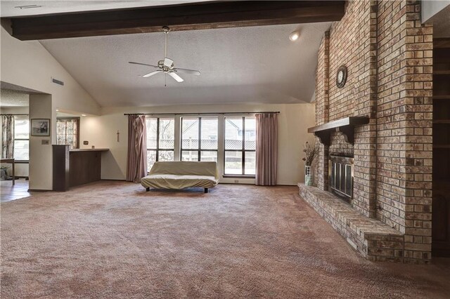 2301 S Stilwell St, Pittsburg, KS 66762 - unfurnished living room with beam ceiling, ceiling fan, high vaulted ceiling, and carpet flooring