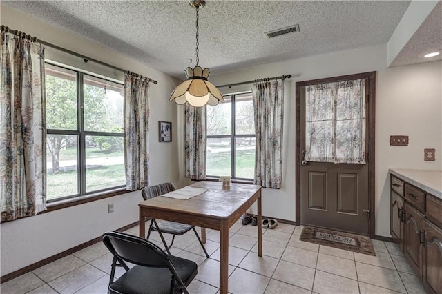 2301 S Stilwell St, Pittsburg, KS 66762 - dining space featuring visible vents, a textured ceiling, and a healthy amount of sunlight