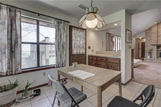 2301 S Stilwell St, Pittsburg, KS 66762 - dining room featuring a textured ceiling, light tile patterned floors, baseboards, and visible vents