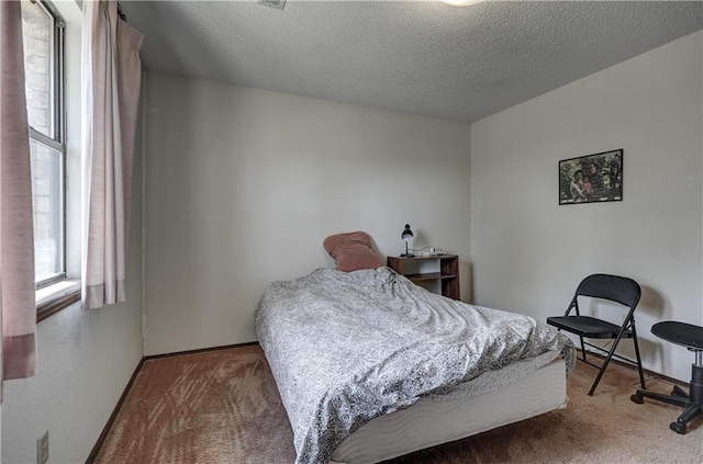2301 S Stilwell St, Pittsburg, KS 66762 - bedroom with carpet, a textured ceiling, and baseboards