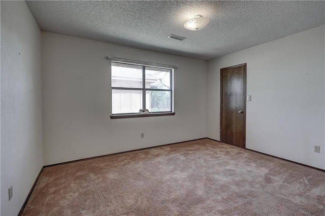 2301 S Stilwell St, Pittsburg, KS 66762 - carpeted empty room featuring a textured ceiling, baseboards, and visible vents