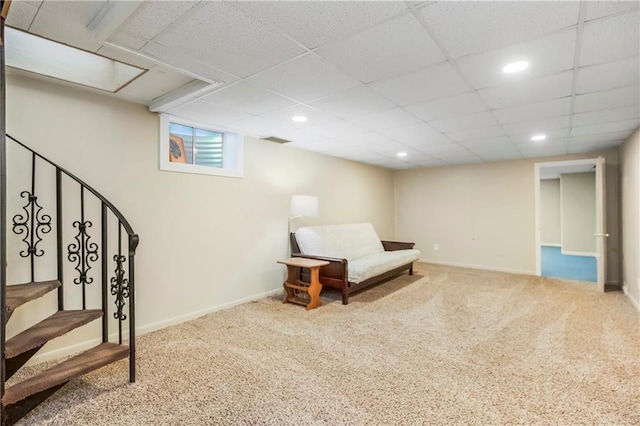 living area featuring baseboards, visible vents, and carpet floors