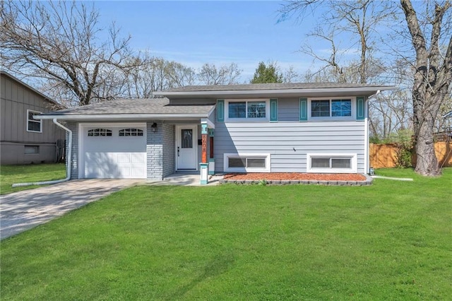 8608 E 91st St, Kansas City, MO 64138 - split level home featuring an attached garage, driveway, and a front lawn