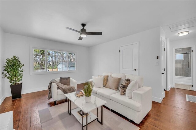 8608 E 91st St, Kansas City, MO 64138 - living room with visible vents, ceiling fan, wood-type flooring, and baseboards