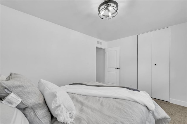 8608 E 91st St, Kansas City, MO 64138 - bedroom with carpet floors, a closet, and visible vents