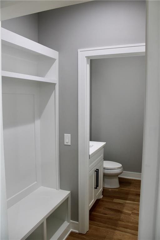interior space featuring dark wood-type flooring and baseboards
