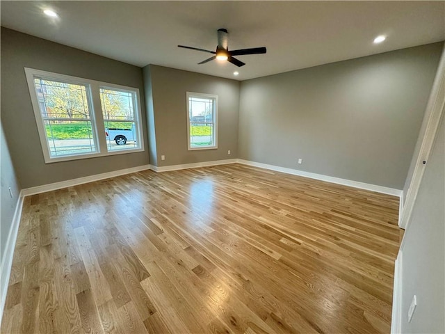 spare room featuring recessed lighting, light wood finished floors, baseboards, and ceiling fan