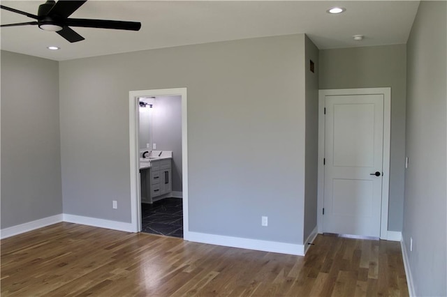 unfurnished bedroom with baseboards, recessed lighting, and wood finished floors