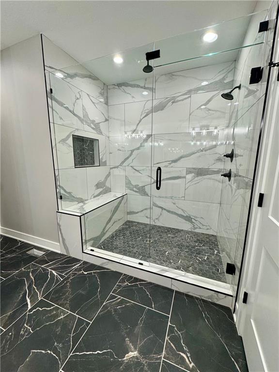full bathroom with a marble finish shower, baseboards, recessed lighting, and marble finish floor