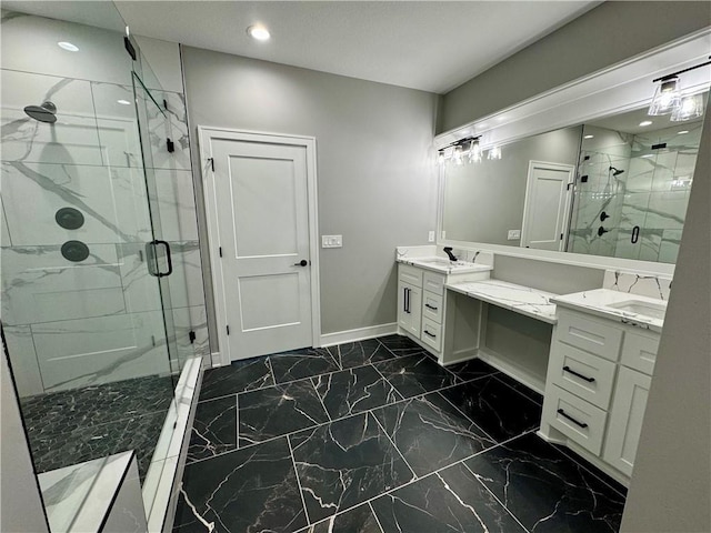 bathroom featuring a marble finish shower, baseboards, marble finish floor, and vanity