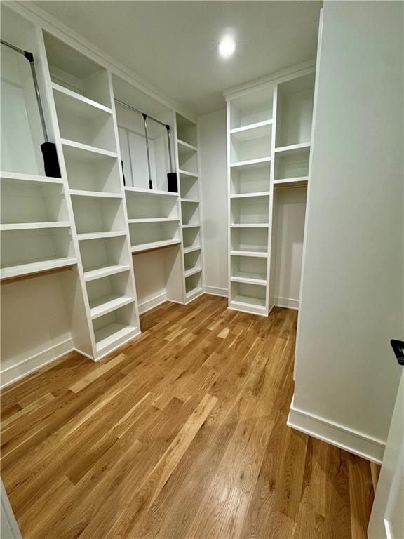 spacious closet with wood finished floors