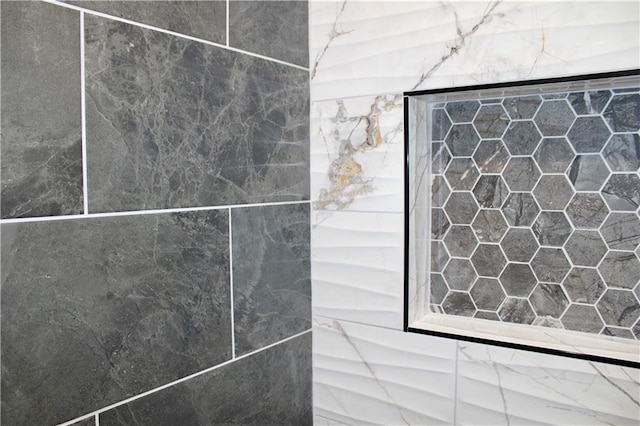 details with a tile shower