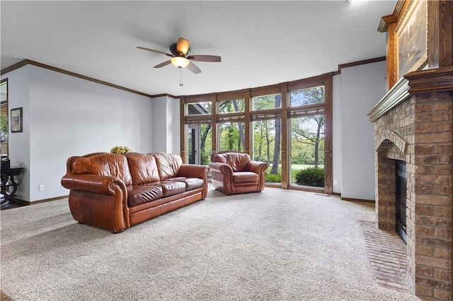 5316 NE Northgate Xing, Lees Summit, MO 64064 - living room with carpet floors, ornamental molding, a fireplace, ceiling fan, and baseboards